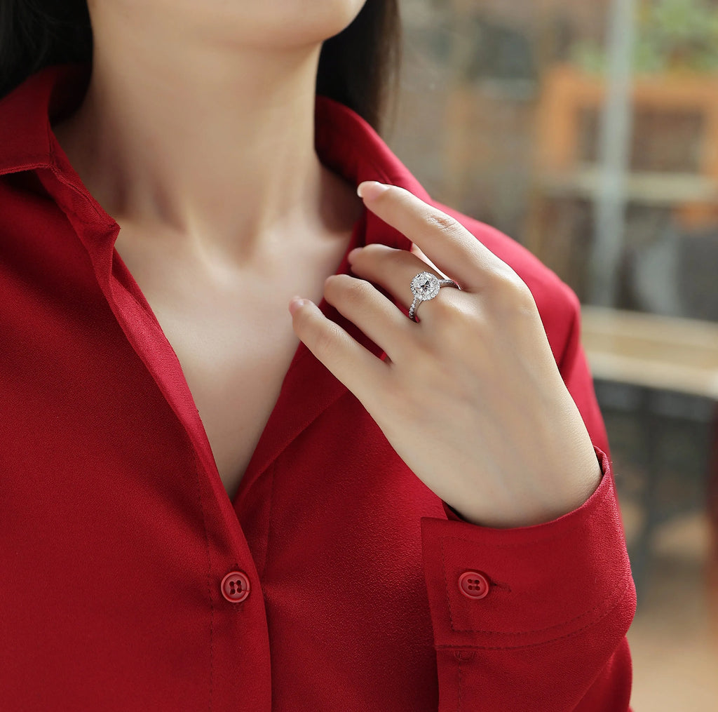 Audrey moissanite wedding ring set with egg-shaped 7x9mm stone in S925 silver platinum plating on white background