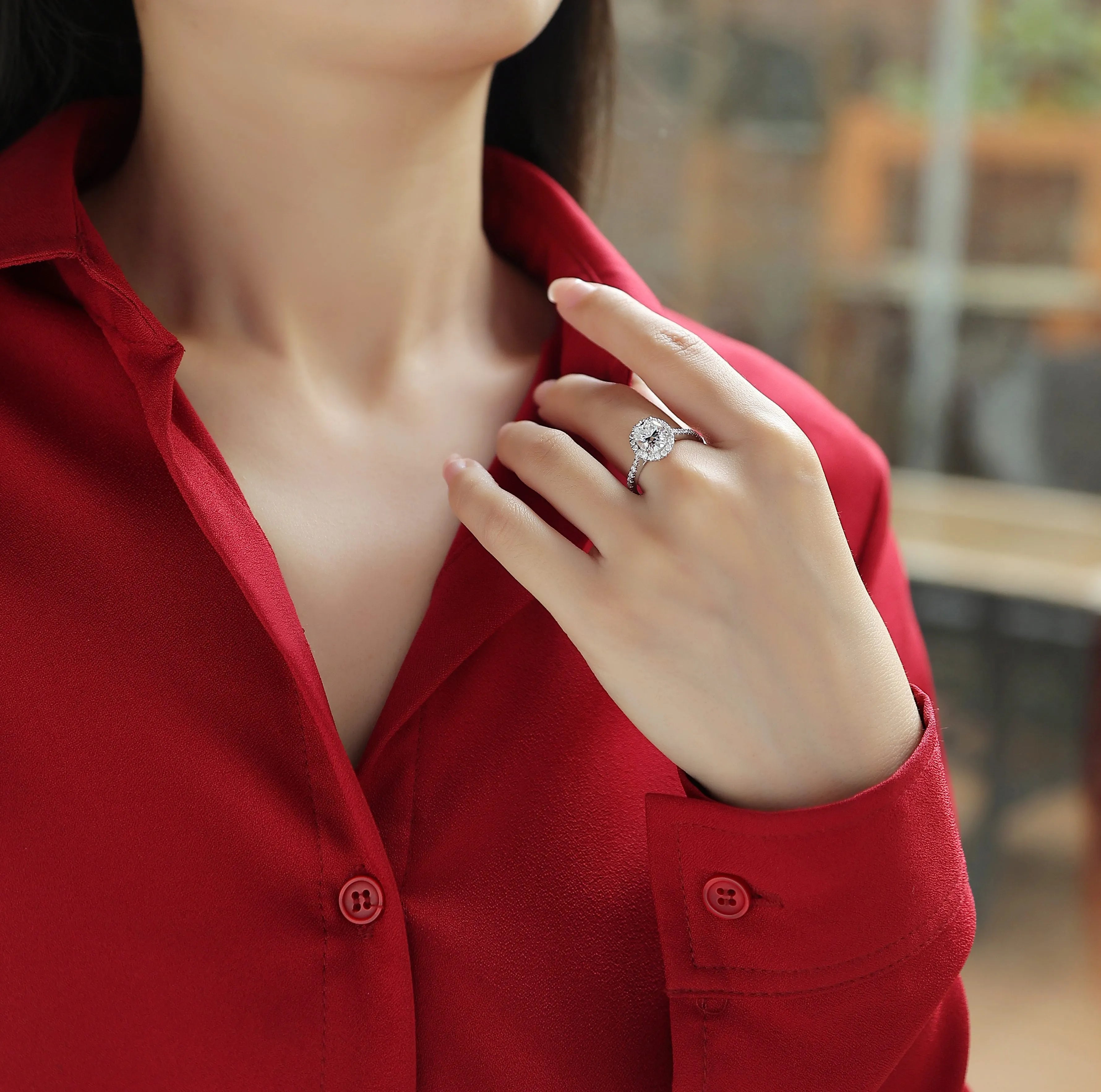 Audrey moissanite wedding ring set with egg-shaped 7x9mm stone in S925 silver platinum plating on white background