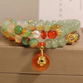 Women's peacock green agate double ring bracelet with safety buckle closure and rhinestone accents