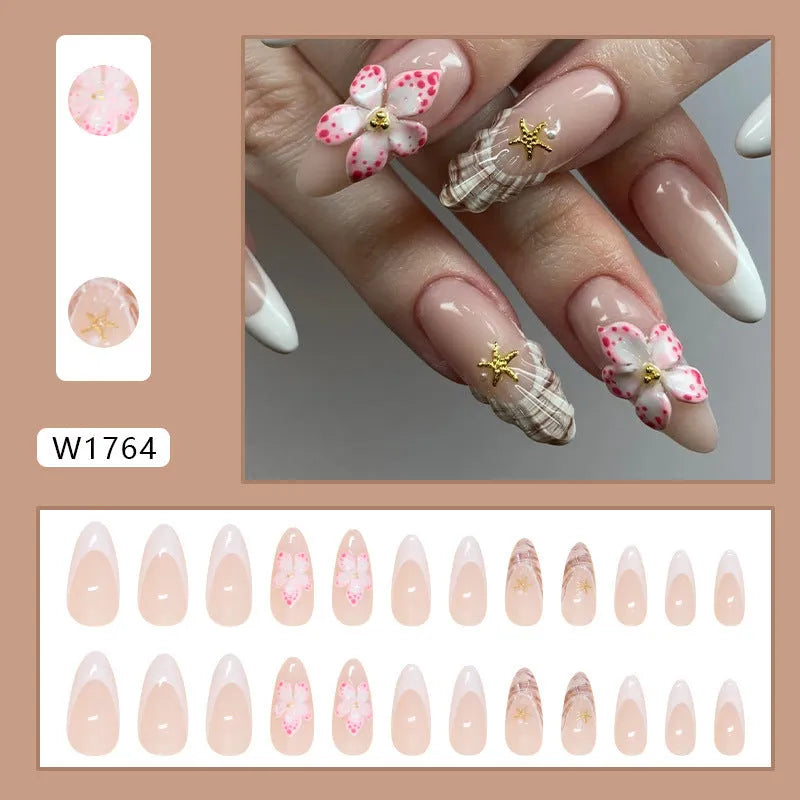 French style artificial false nails with a grey rock pattern and white flower patch design on a plastic card.