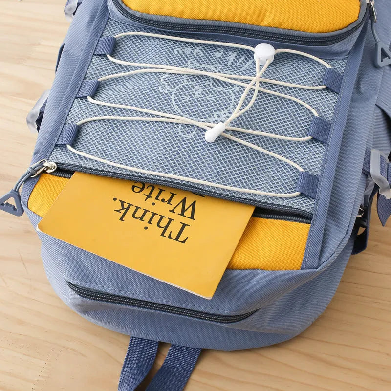 Nylon student backpack in four colour options with curved shoulder straps for junior high school