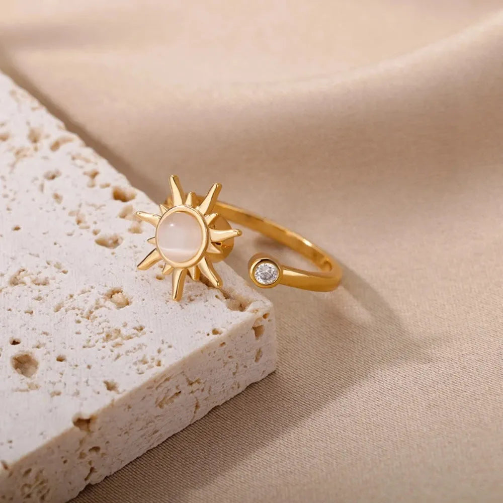 Geometric rotatable ring with adjustable opening in gold electroplated finish on copper base