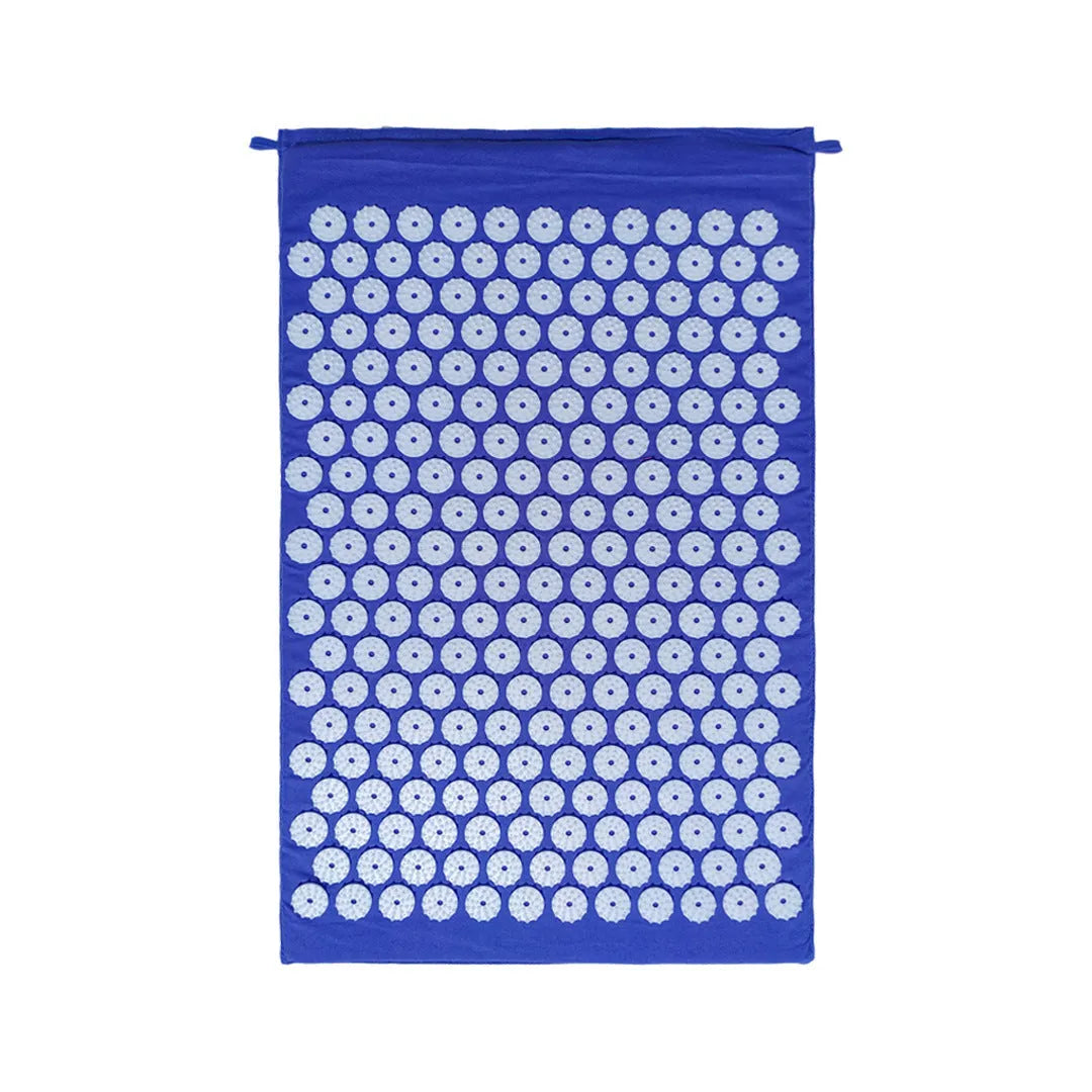 Black and blue acupuncture massage mat set with cushion and headrest on floor for yoga and massage