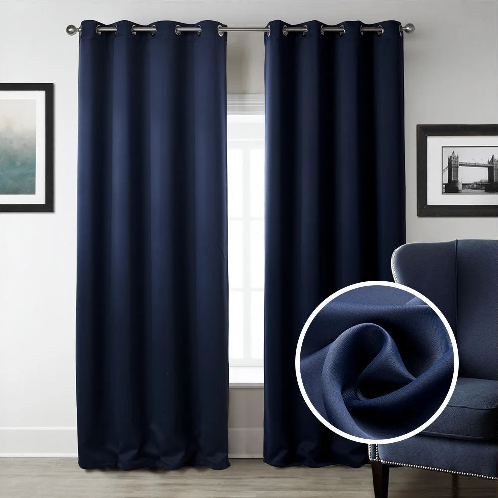 Dark navy blue blackout curtain hanging, showing its modern simple style and light-blocking fabric.