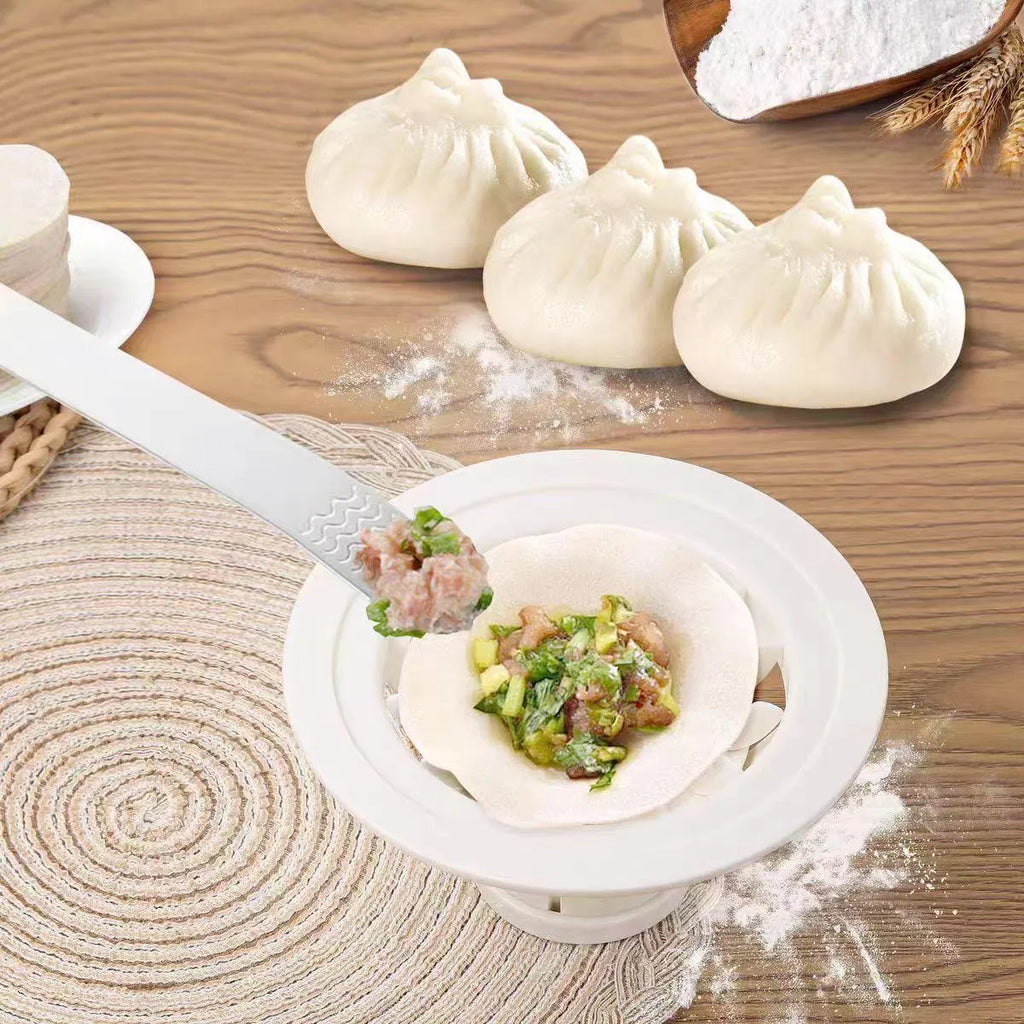 Four identical black plastic steamed bun moulds for making baozi and dumplings