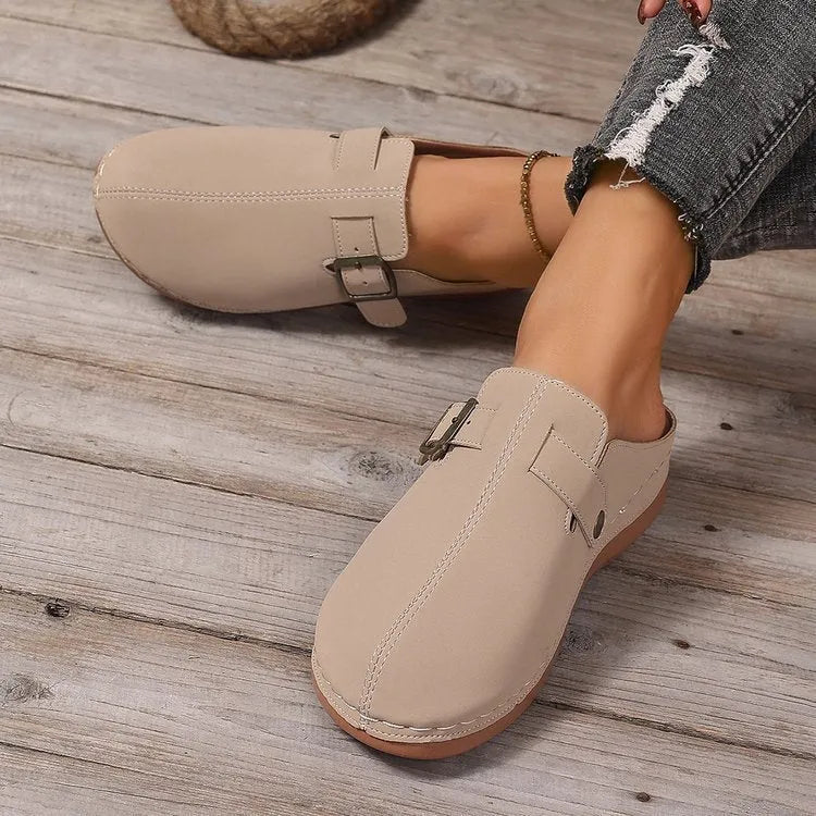 Women's lightweight wedge slipper in cloth with rubber sole, shown in one of five colours.