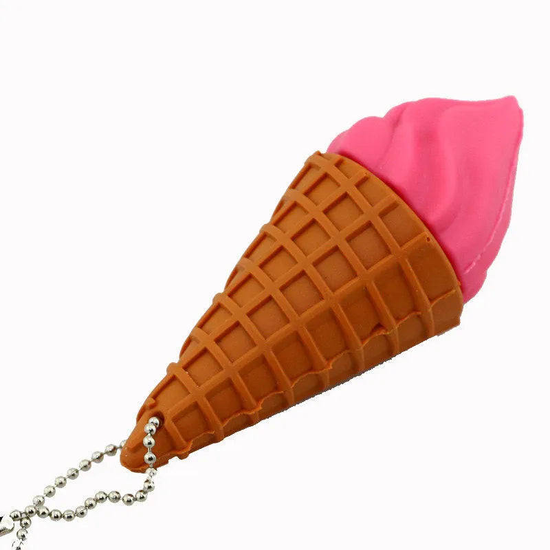 Mini pink ice cream shaped USB flash drive with a white chocolate drip, showing the metal USB connector.