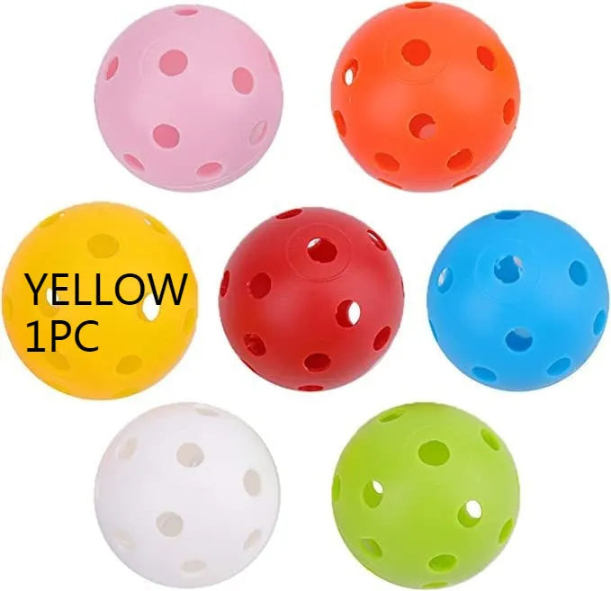 Multi-colour golf practice balls in red, orange, blue, green, white, and yellow shown in a net bag.