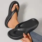 Women's thick-soled EVA flip-flops in black, white, or grey colours with non-slip sole design