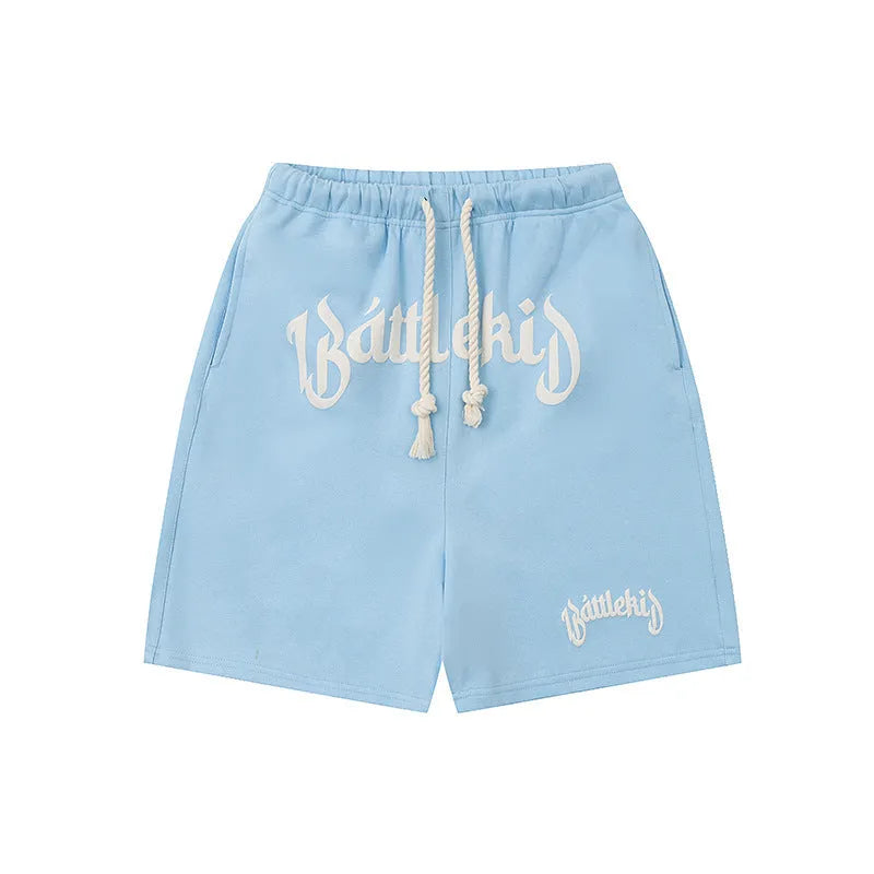 Cropped cotton-blend sweatpants shorts in loose casual street style.