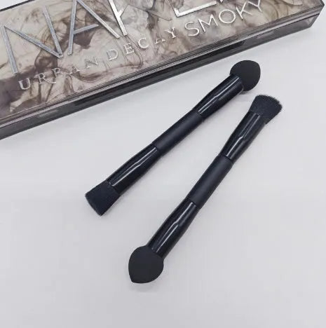 Double-headed miter sponge concealer brush with black artificial fibre bristles on wooden handle