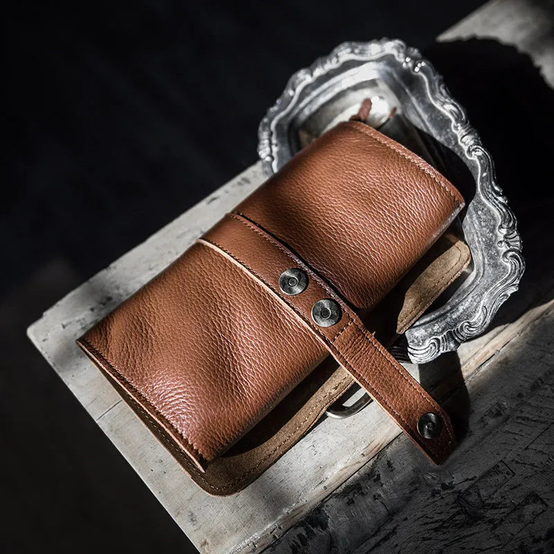 Handmade cow leather vintage wallet showing tape extraction closure and solid colour design