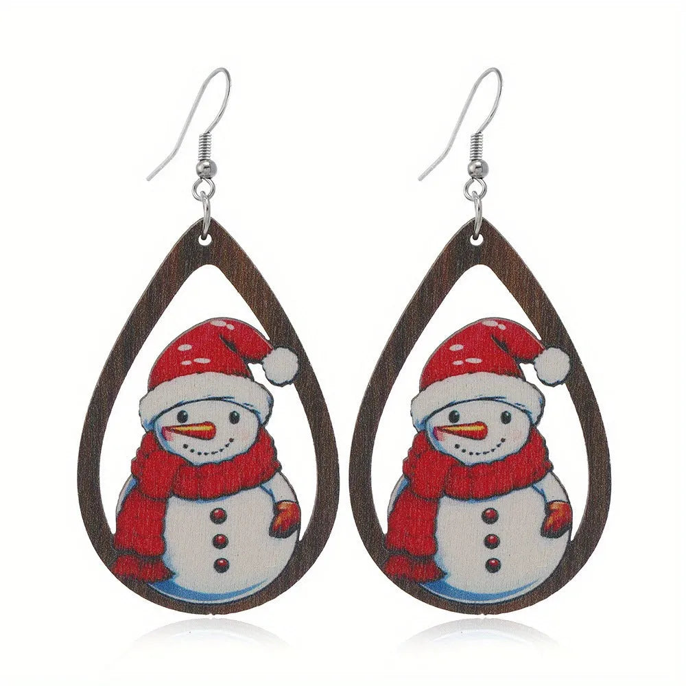 Pair of wooden geometric Christmas earrings with Santa Claus design in red and green colours.