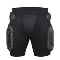 Black cycling hip protection pants with integrated pads, showing hook and loop fastener closures.