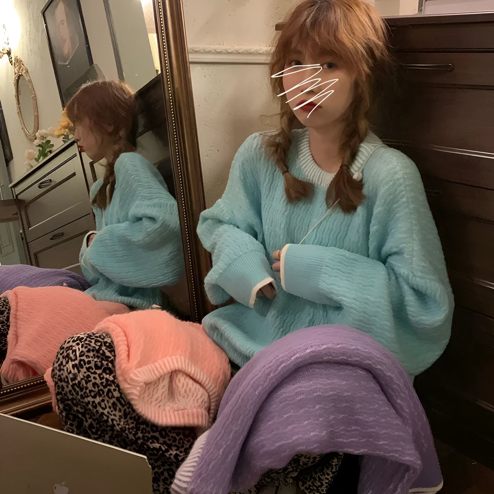 A loose-fit women's pullover sweater in a solid colour, shown in lake blue, purple, and pink options.