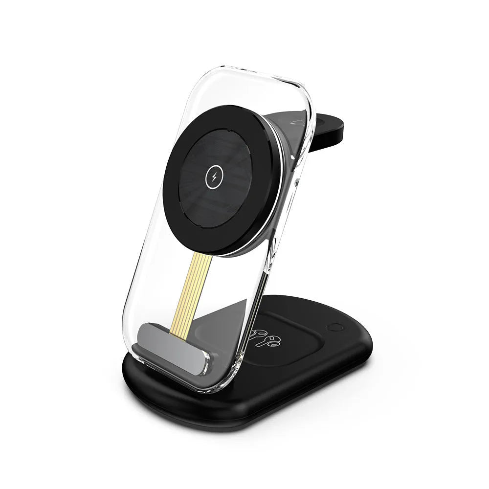 Transparent foldable magnetic wireless charger showing internal coils, unfolded on a table next to a smartphone.