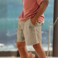 Men's straight-leg cotton blend shorts with elastic drawstring waist and printed plant pattern.