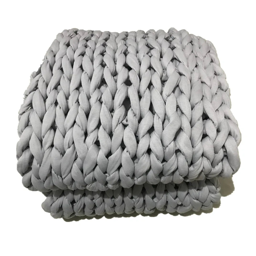 Hand-woven weighted blanket in chenille polyester, beige colour, 100x100cm size, with textured weave visible