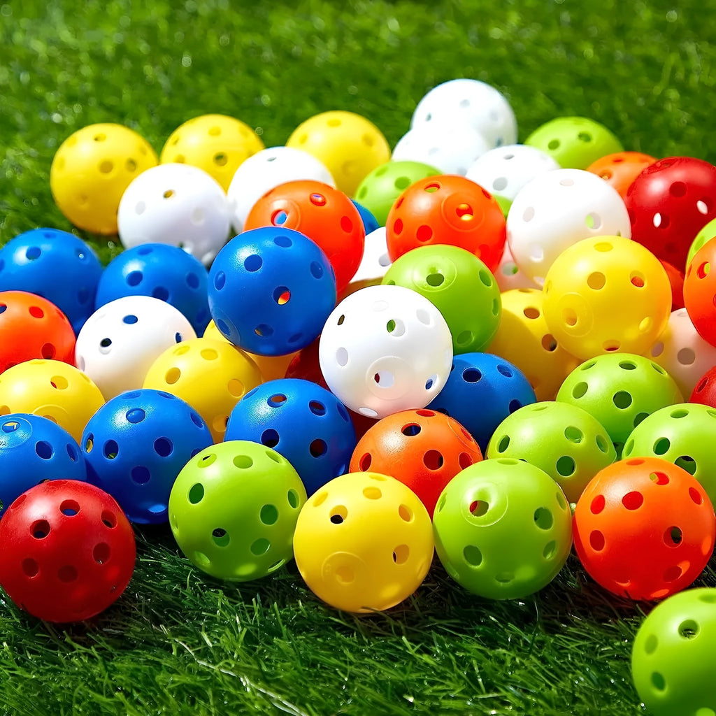 Multi-colour golf practice balls in red, orange, blue, green, white, and yellow shown in a net bag.