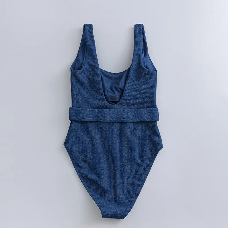 Navy blue women's slim-fitting one-piece triangle swimsuit on a mannequin.