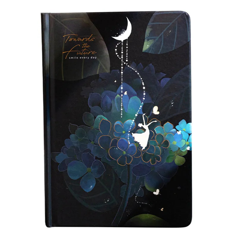 A5 notebook with luminous cover open to show pages filled with colour illustrations.