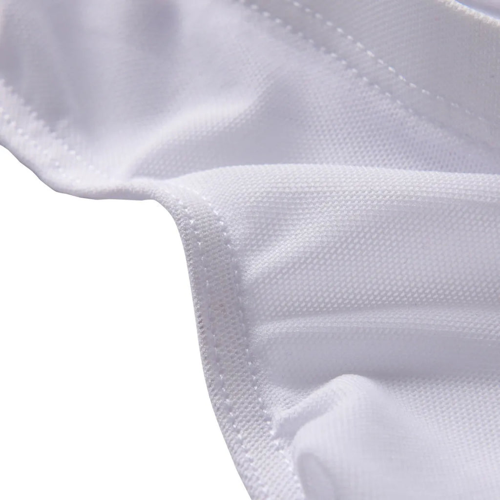 Men's black low-waist knitted nylon briefs laid flat, showing triangle style and quick-dry fabric texture.