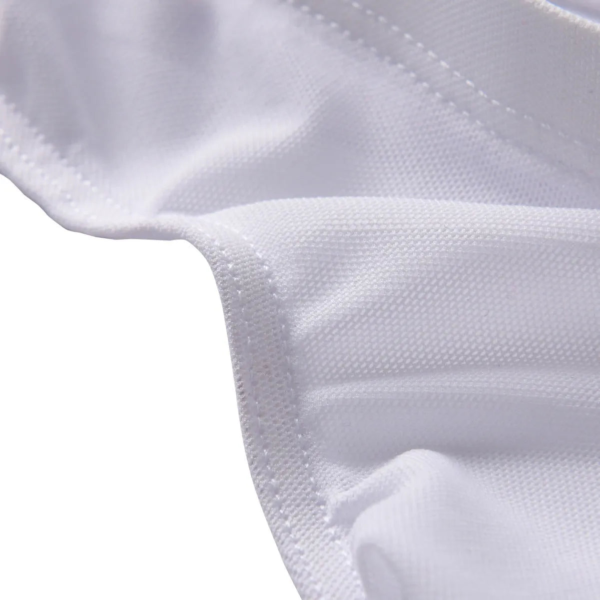 Men's black low-waist knitted nylon briefs laid flat, showing triangle style and quick-dry fabric texture.