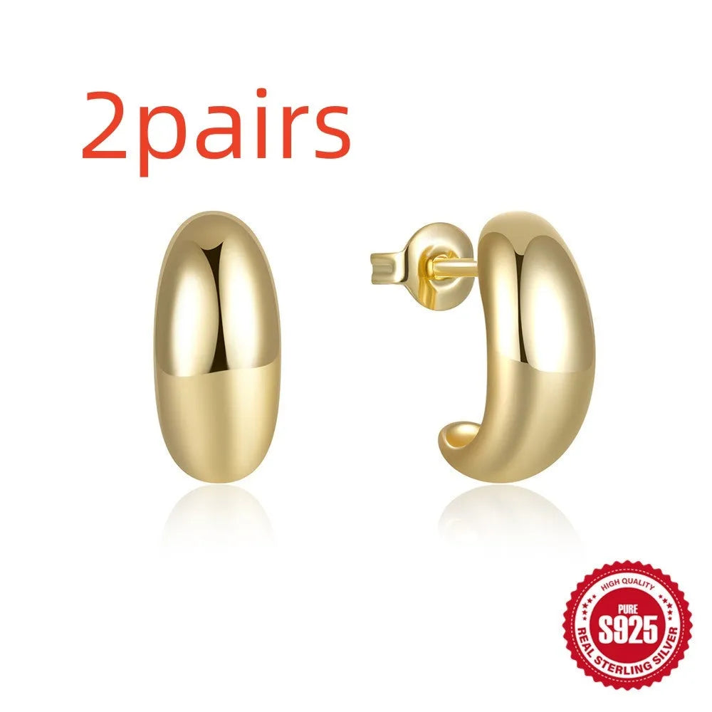 S925 sterling silver C-shaped ringstud earrings with a glossy gold electroplated finish.