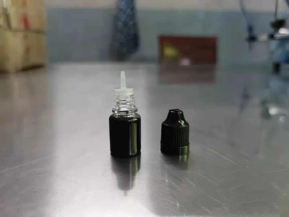 A small bottle containing 5ml of black confidentiality seal ink for privacy stamps.