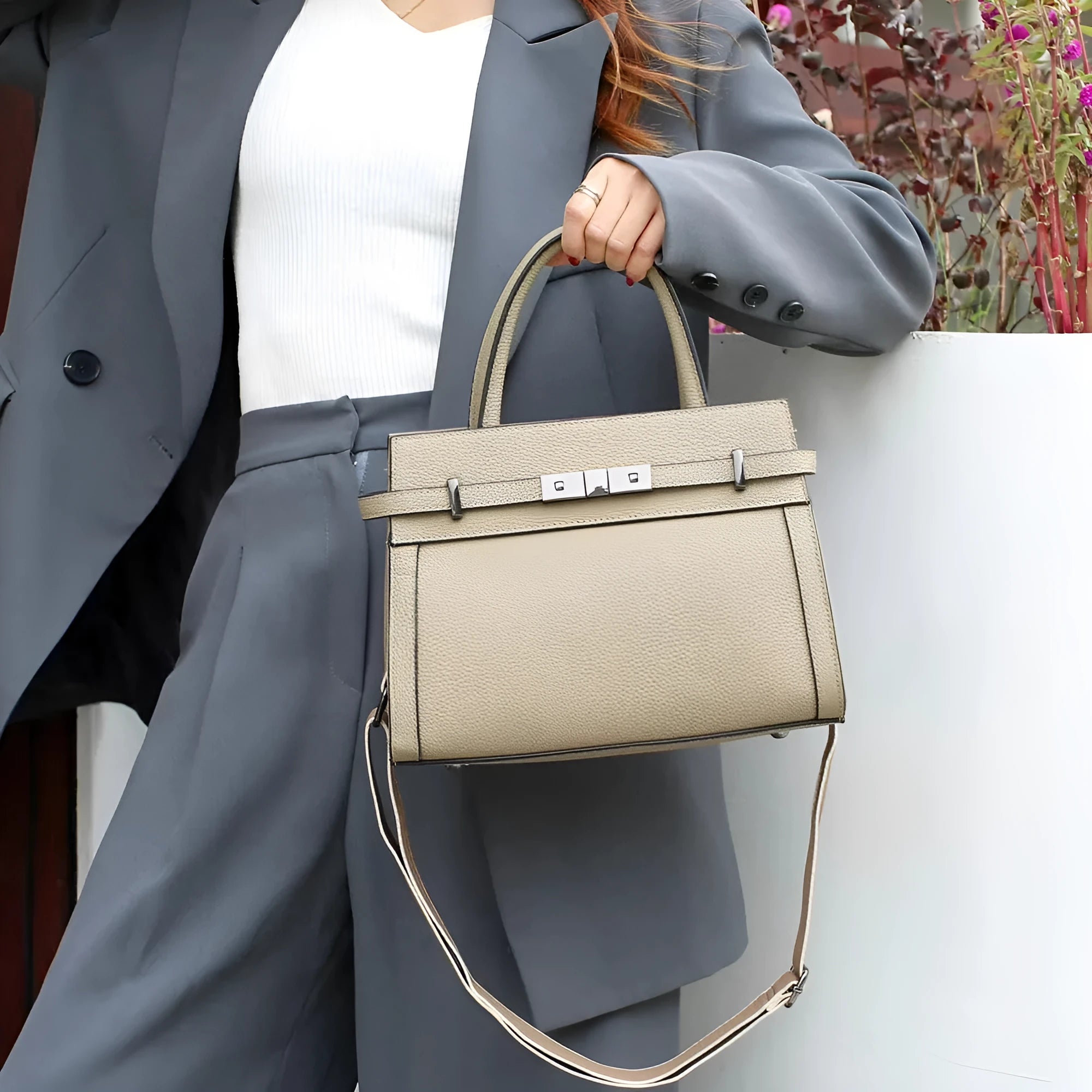 Small square horizontal genuine leather shoulder bag in almond green with visible stitching and shoulder strap