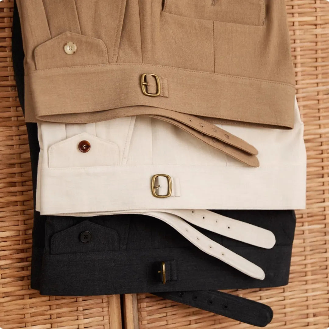 Men's slim fit straight leg trousers in light brown, laid flat.
