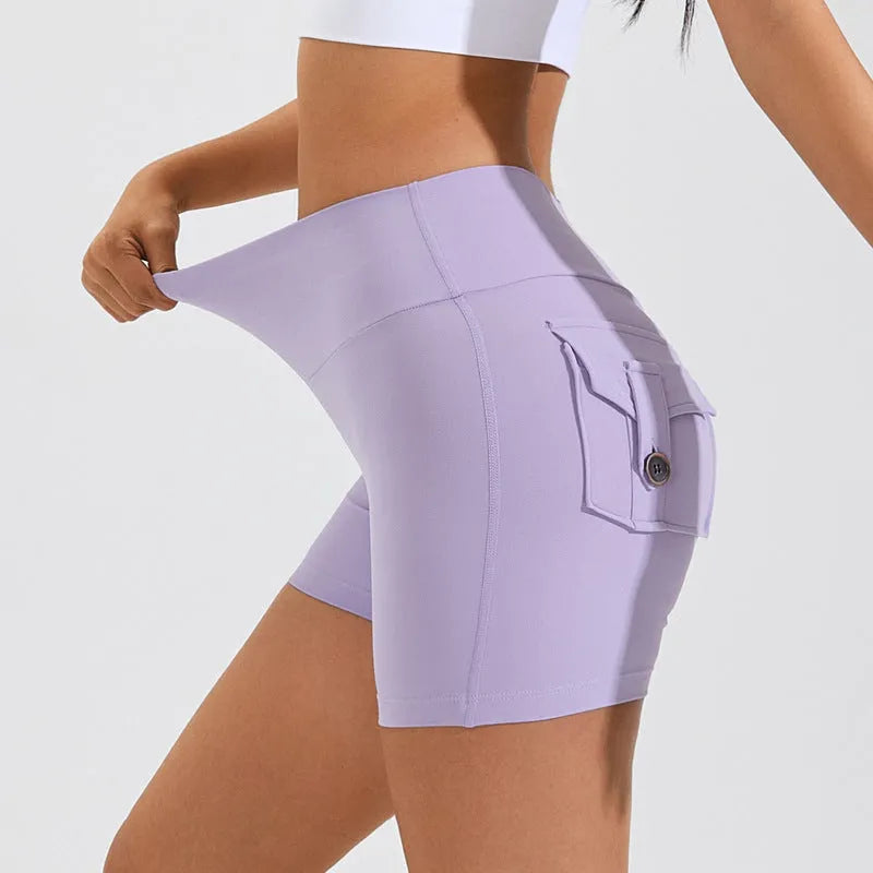 Women's high waist hip lifting shorts in electric blue colour with pockets for fitness activities