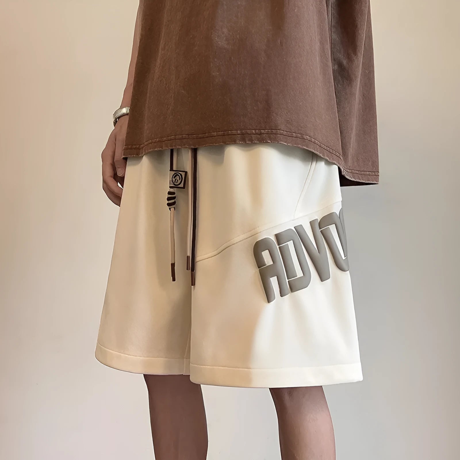Loose high-waist polyester sports shorts in beige, black, coffee colour, and green for women