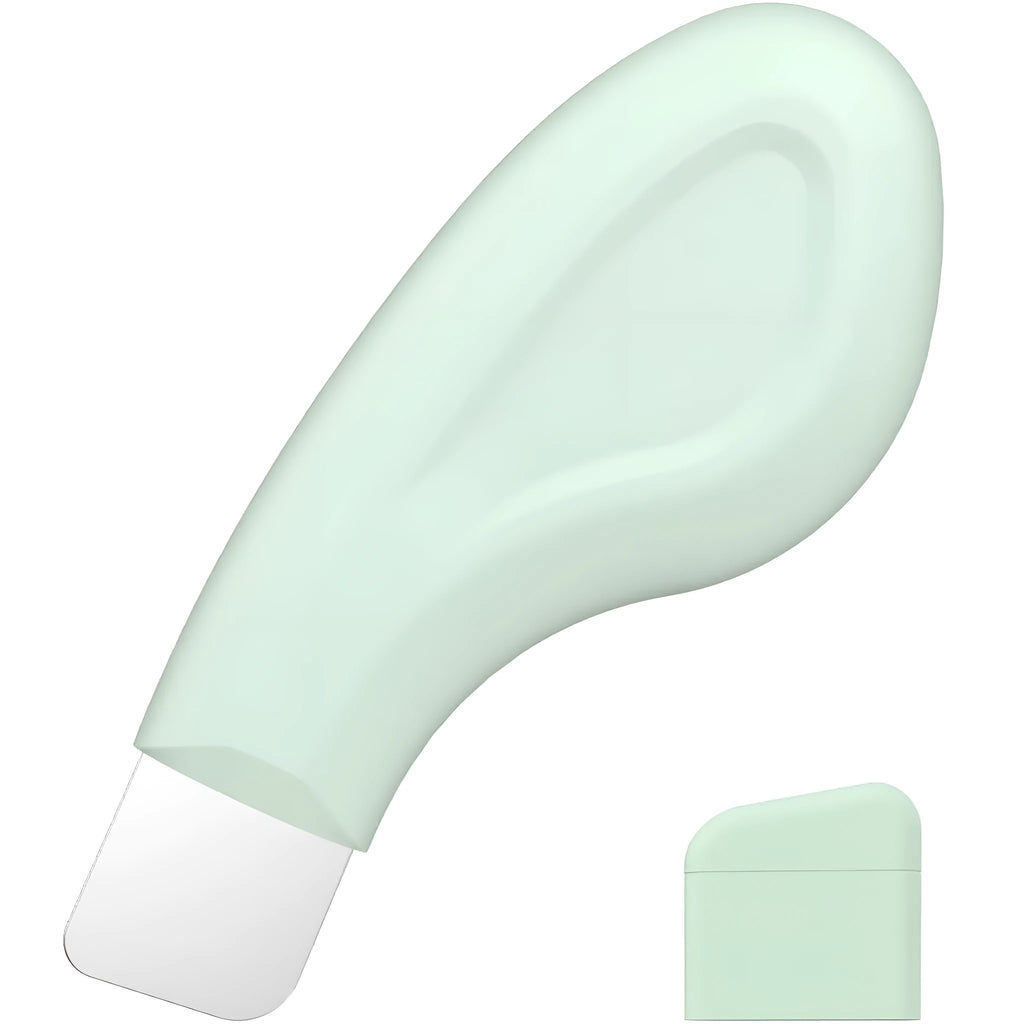 Stainless steel blackhead scraper tool with a non-slip handle on a green background.