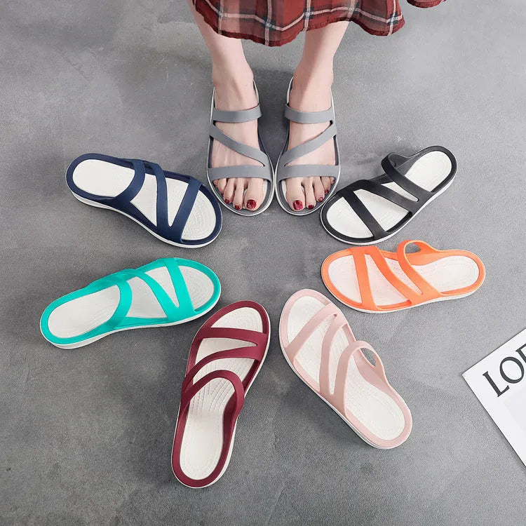 Women's casual sandals in red, made from breathable PP material, shown from the side.
