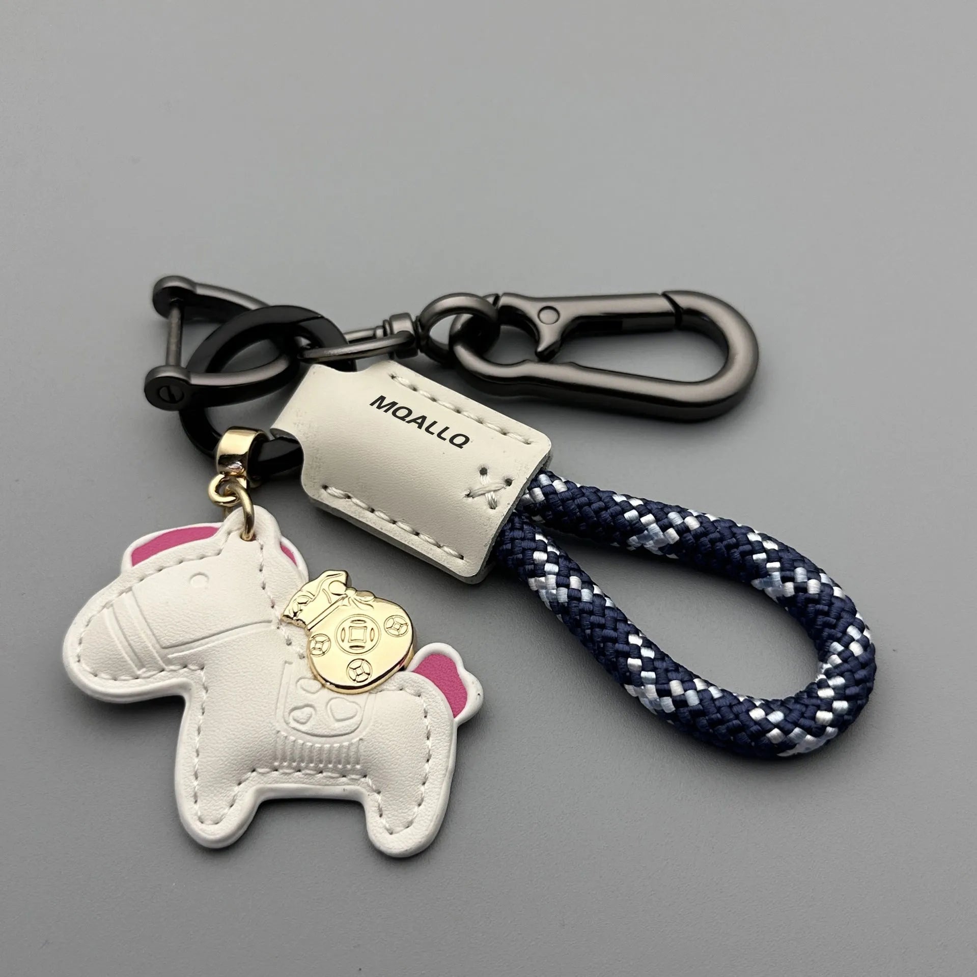 Handmade cowhide car key ring pendant with zinc alloy pony belt buckle on a colourful flanelle rope.