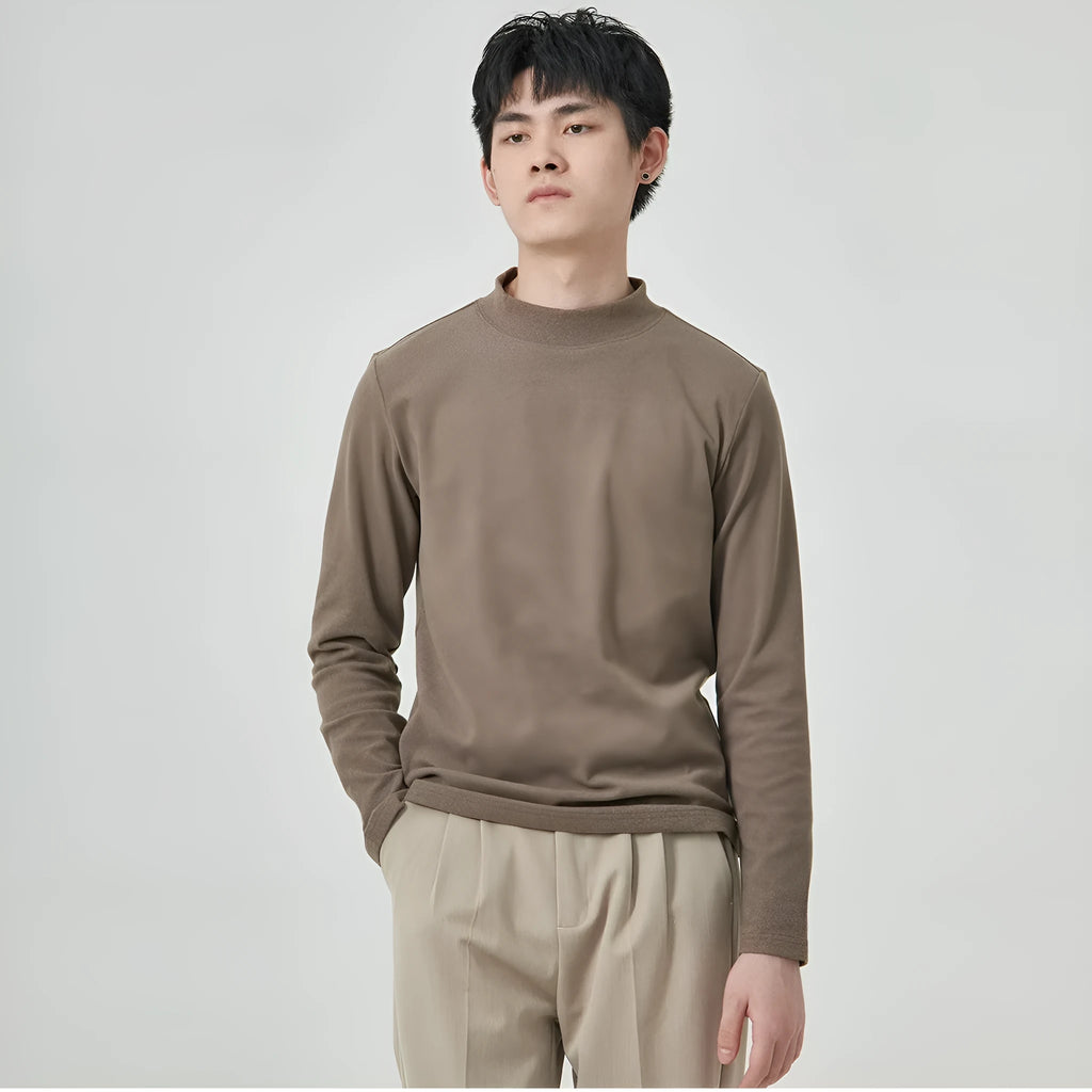 Men's brown Dralon fabric long sleeve t-shirt with a half-high collar and pullover style.