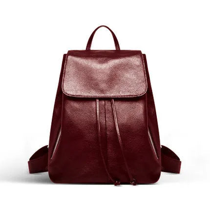 Soft black genuine leather women's backpack in Korean street trend style, showing multiple internal compartments.