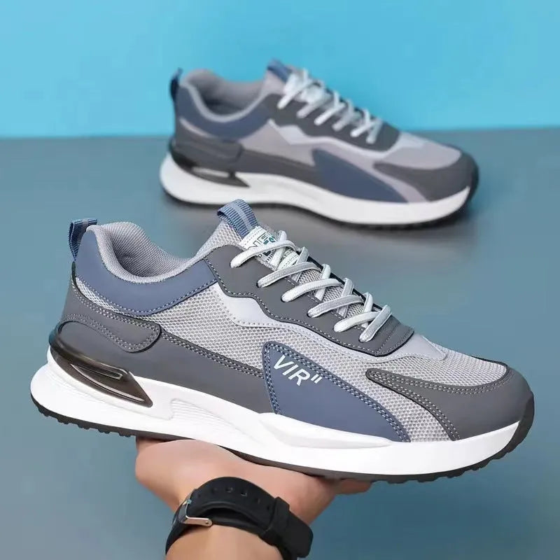 Men's black and grey colour block mesh running shoes with white soles on a plain background.