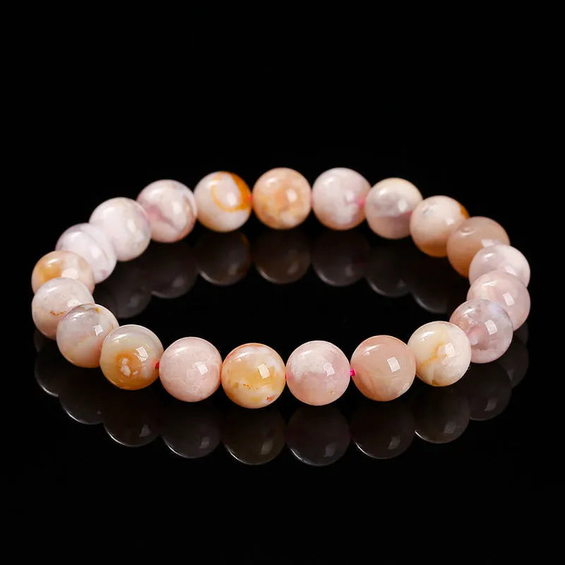 Natural cherry agate bracelet with round beads in a sweet style for women.