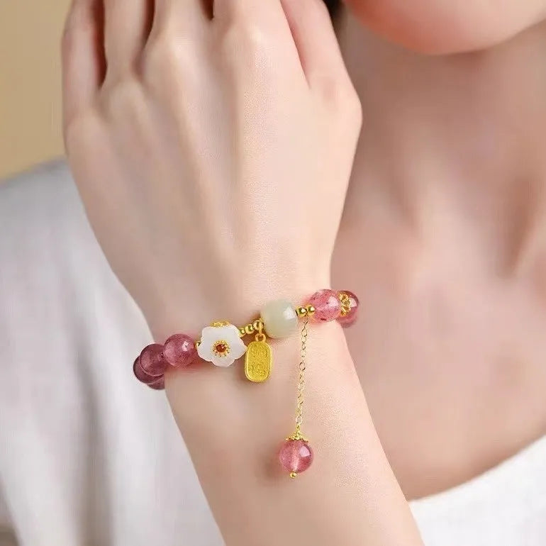 Handmade strawberry quartz crystal bracelet for women showing green strawberry quartz moon design.
