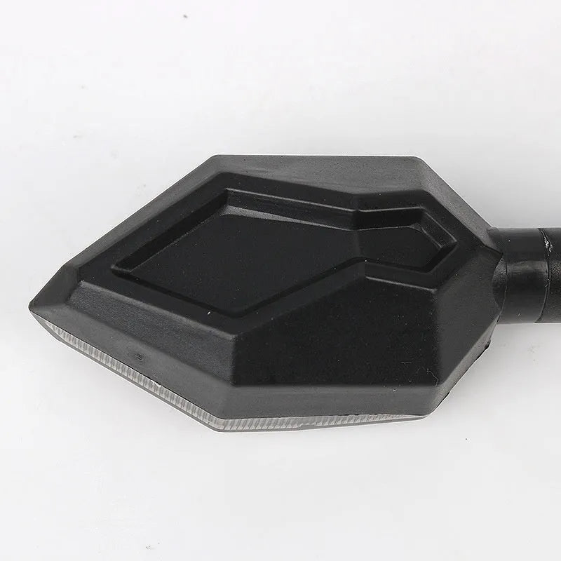 Arrow-shaped LED motorcycle turn signal lamp with 12V universal fitment and ABS plastic housing