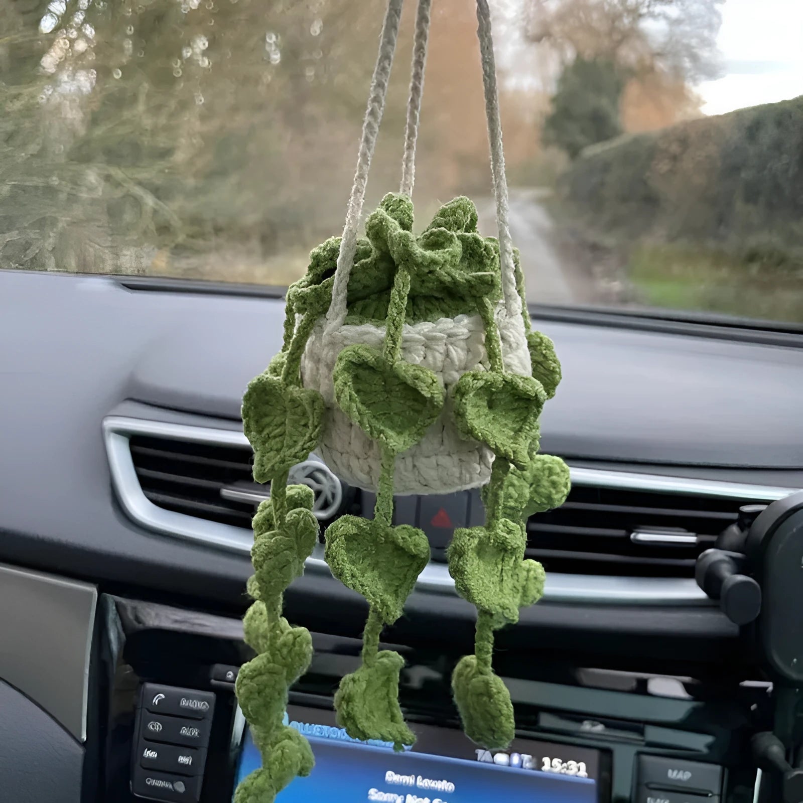 Green and white knitted wool car plant decoration with basin base and hanging rope