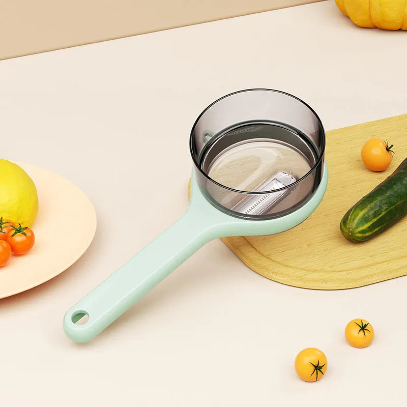 Kitchen peeler with integrated storage bucket in light green colour