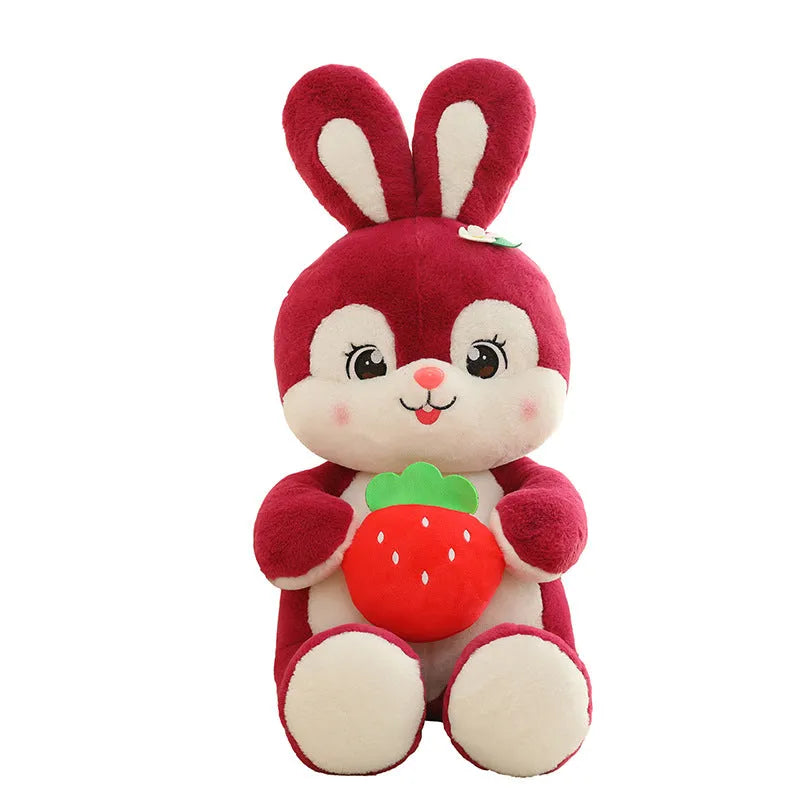 Cartoon strawberry rabbit plush toy doll pillow in pink sitting on a surface
