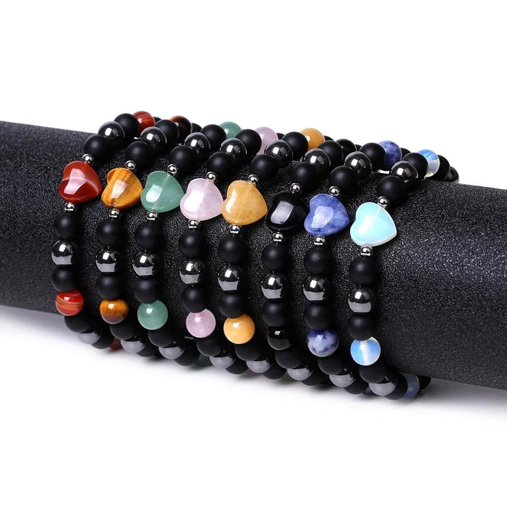 Lvdongling stone bracelet with hand-cut peach heart charm and planetary charms in tigereye colour