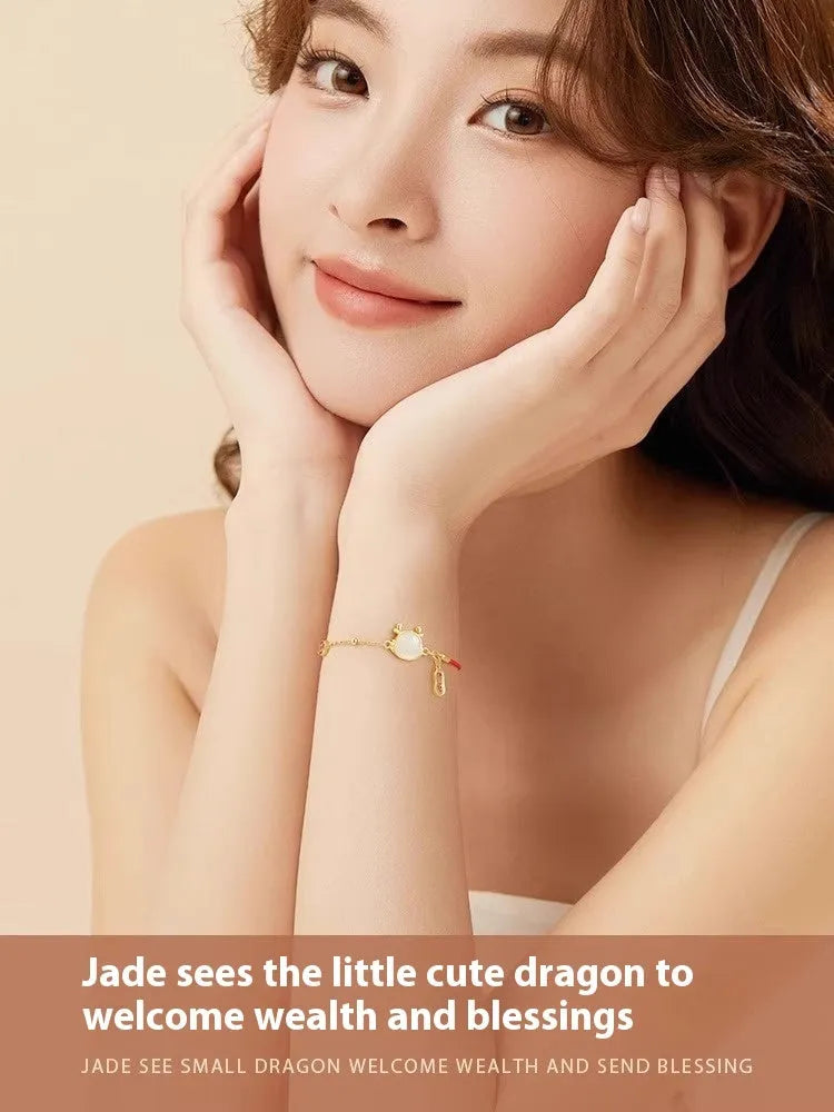 Silver-plated dragon zodiac bracelet with Hetian jade elements for women, showing electroplated finish and animal motif.