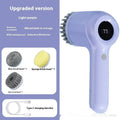 Light grey USB rechargeable electric cleaning brush with multiple interchangeable heads for kitchen use.