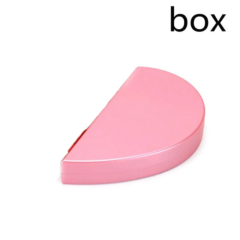 Red heart-shaped rotating ring box with 3D white rose decoration on top.