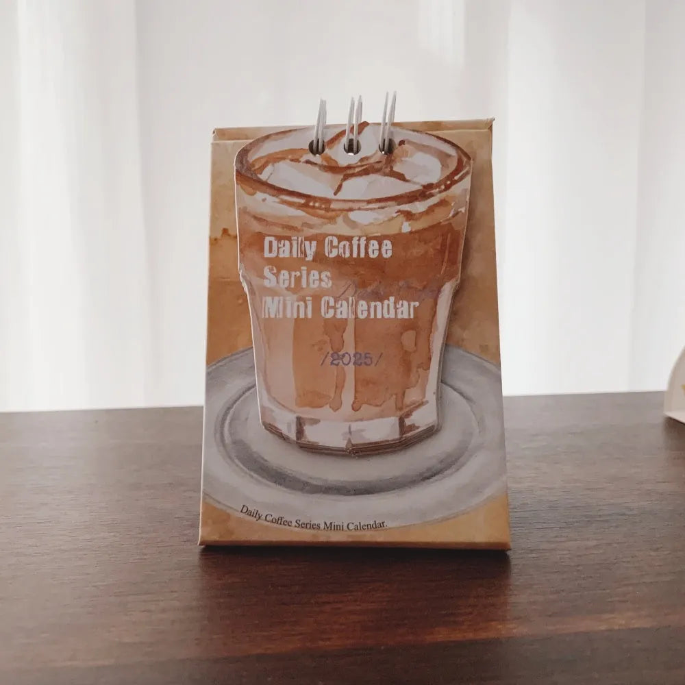 Mini desk calendar 2025 with four themed paper designs including coffee time model